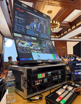 AI video production control room with live monitors and broadcast equipment.