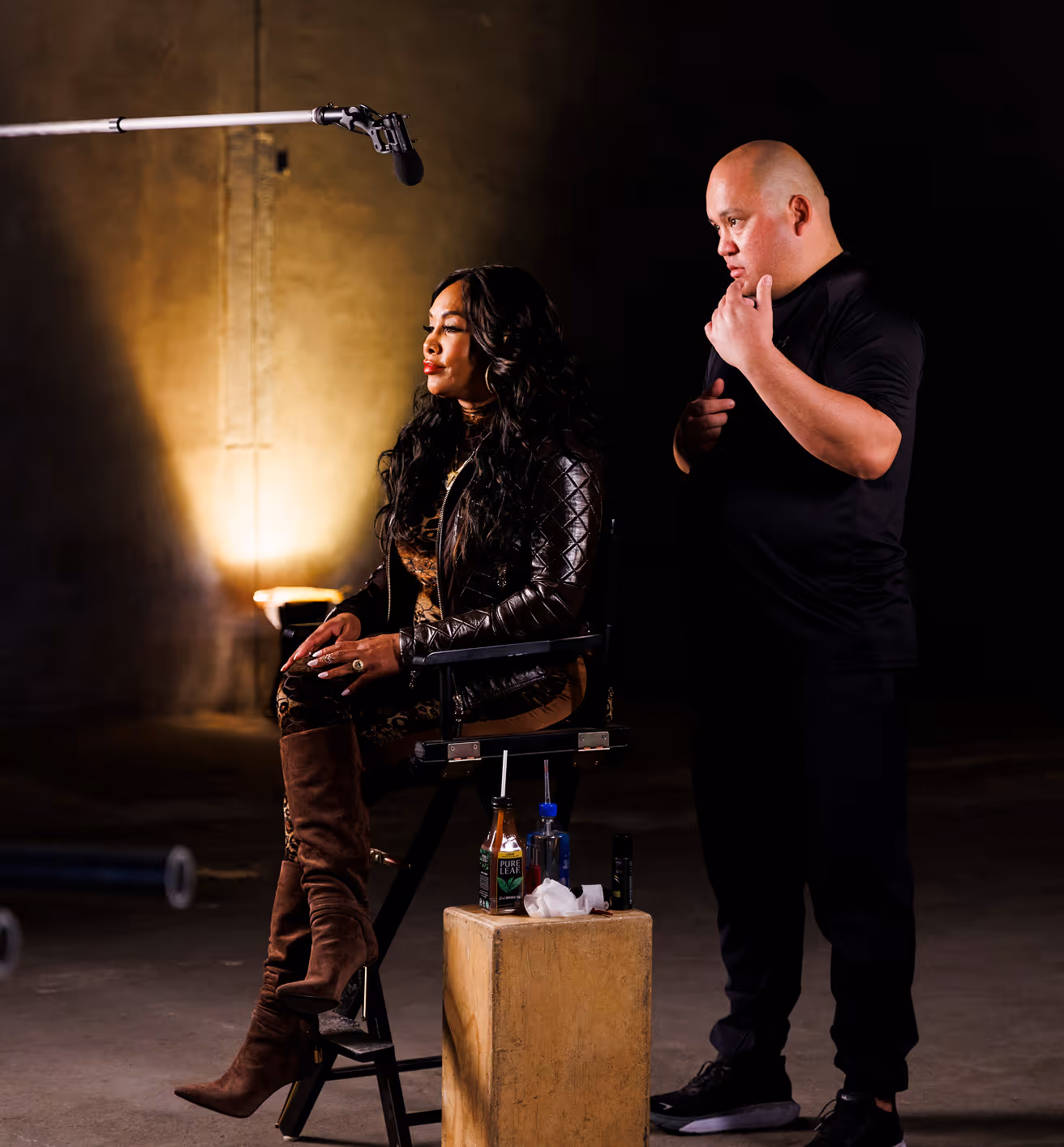Director guiding talent during a casting session on set