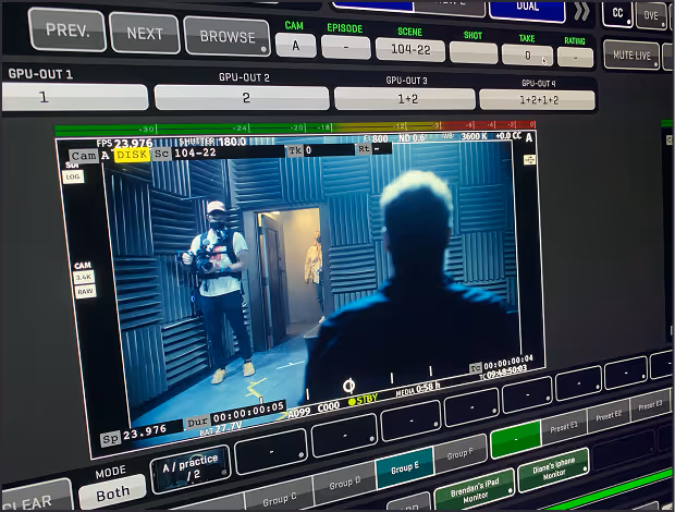 Video monitor and camera controls capturing corporate interview footage on set