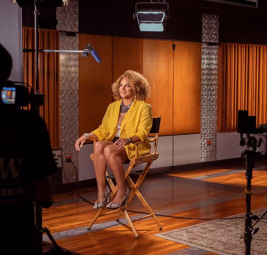 Speaker seated for an interview on a corporate event video shoot