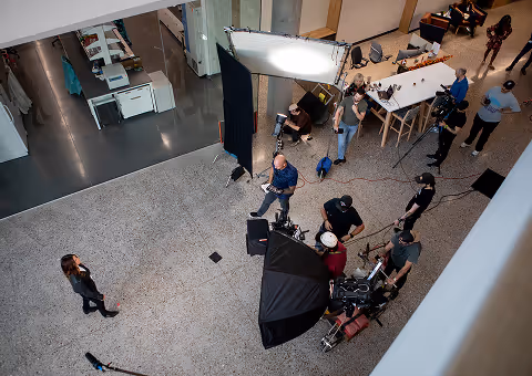 Overhead view of a crew filming a mini documentary for business