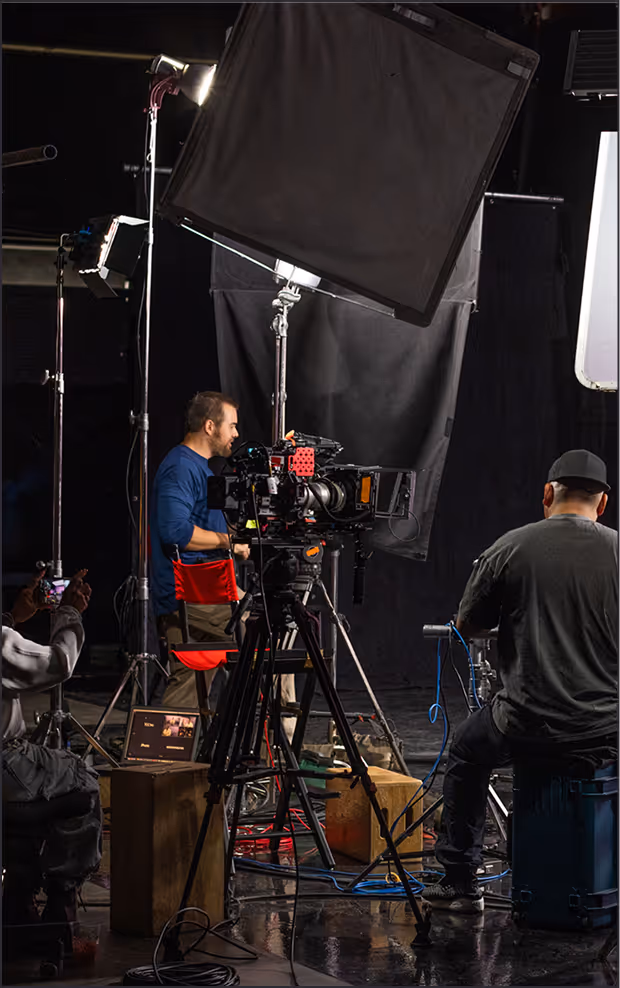 Crew operating a cinema camera on a professional video shoot