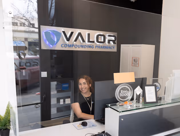 Front Desk rep at Valor smiling