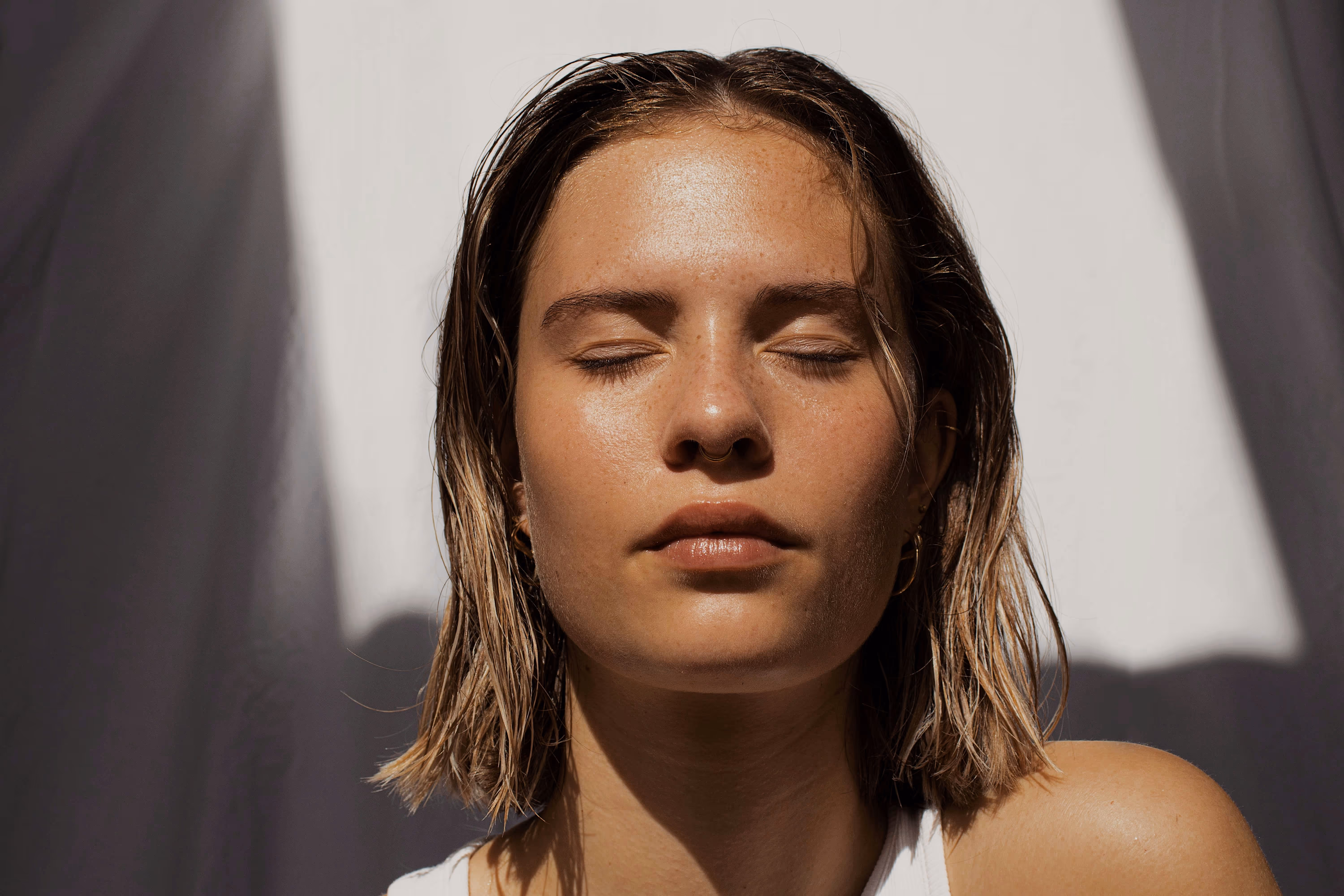 photo of woman with eyes closed