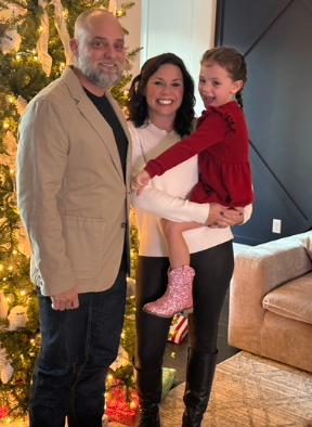 Kaela with husband and daughter.