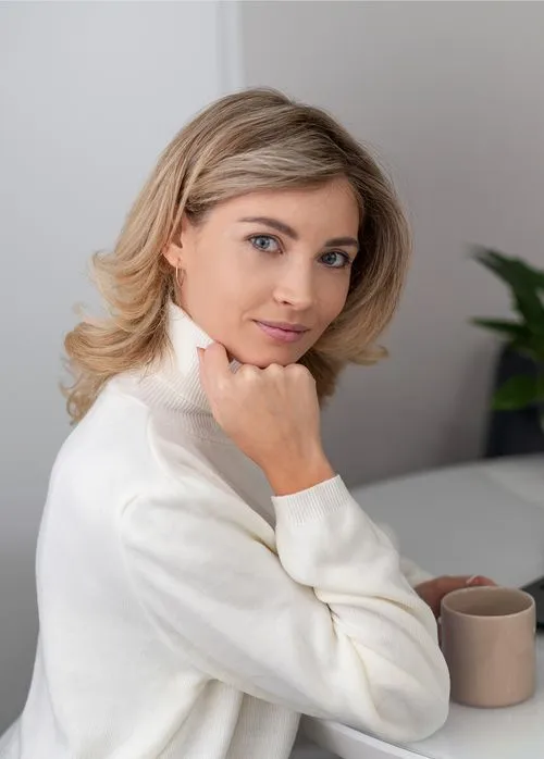 medium shot woman sitting with cup