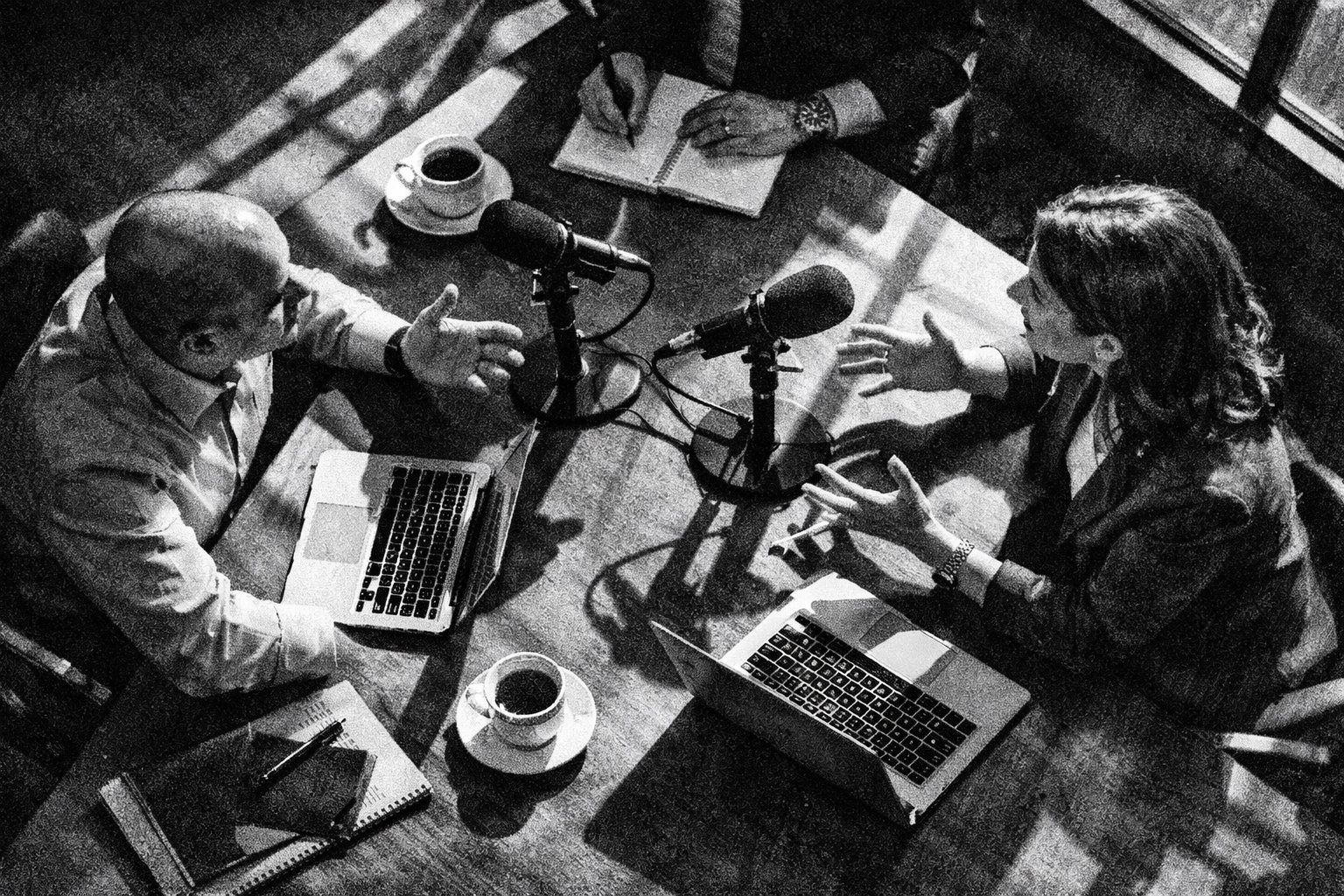 Business professionals collaborating on podcast strategy in meeting