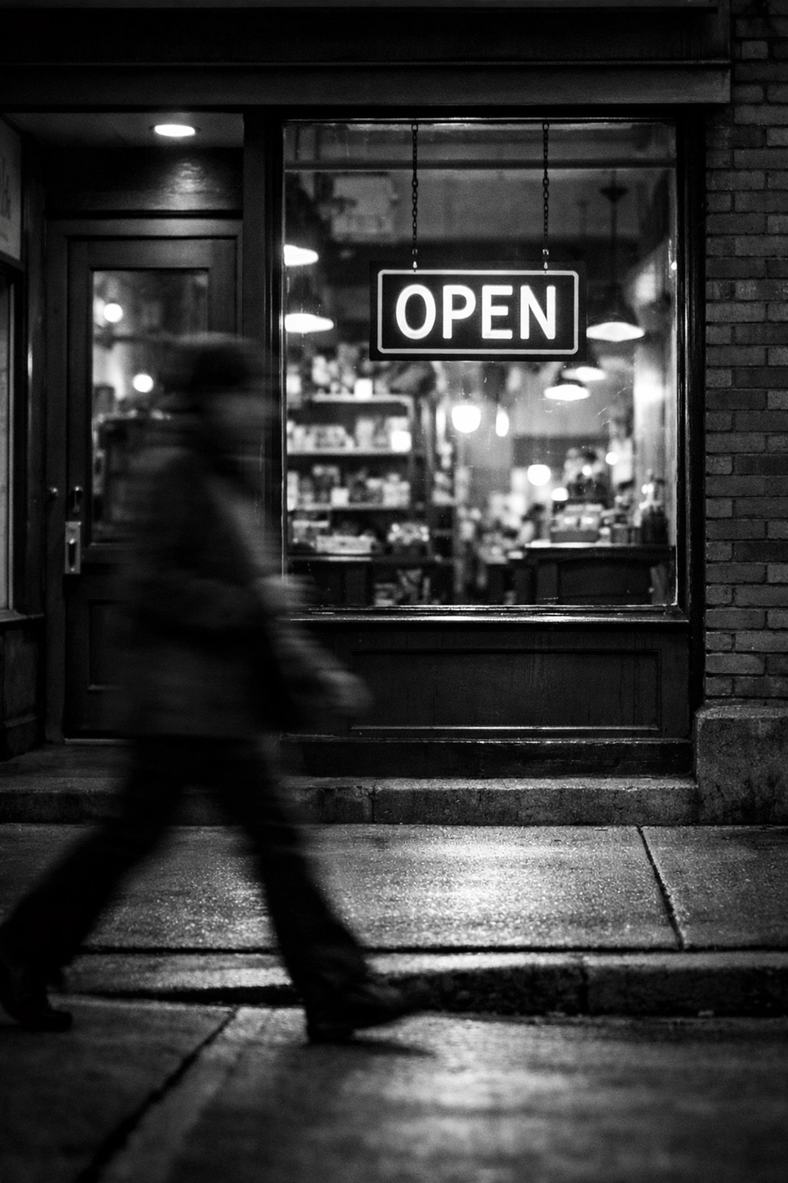 Local business storefront with customer foot traffic and open sign