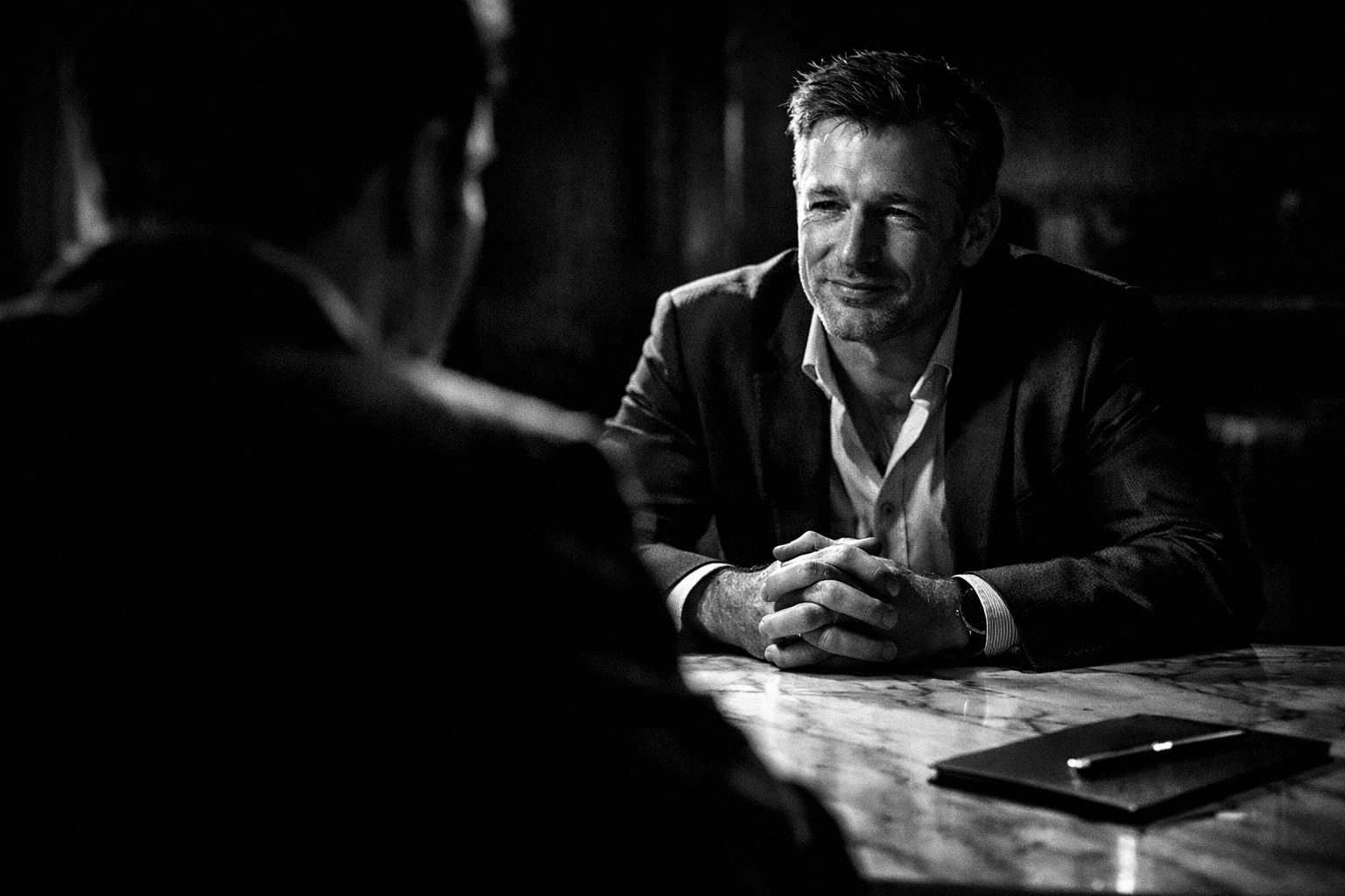 A relieved client talking to a professional, showing the trust built through a customer-centric About Us page.