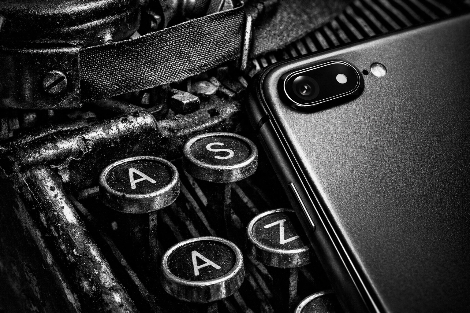 Vintage typewriter next to a modern smartphone showing the evolution of professional brand storytelling.