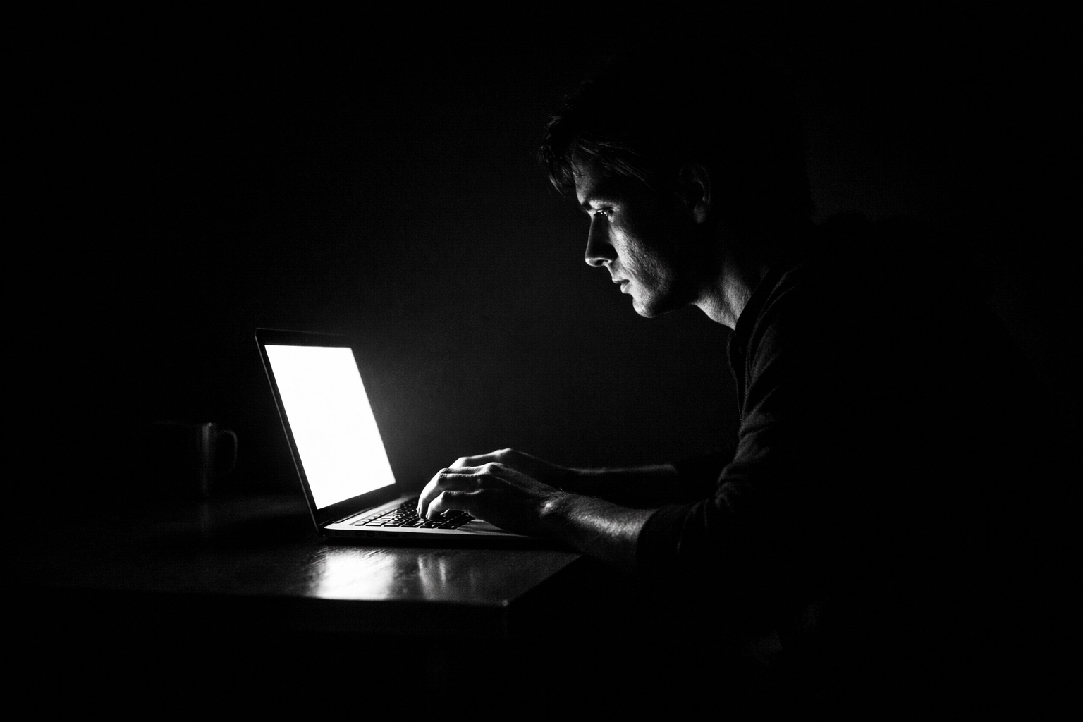 A person focused on deep-dive research on a laptop, reflecting modern intent-driven search habits.