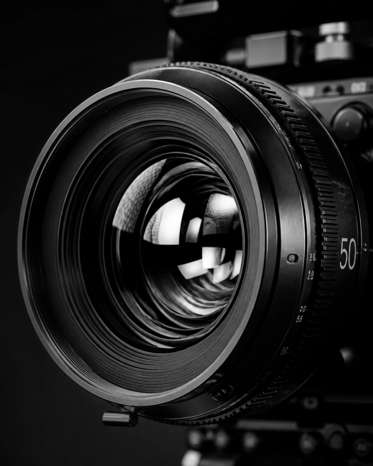 Extreme close-up of a high-end cinema camera lens in B&W