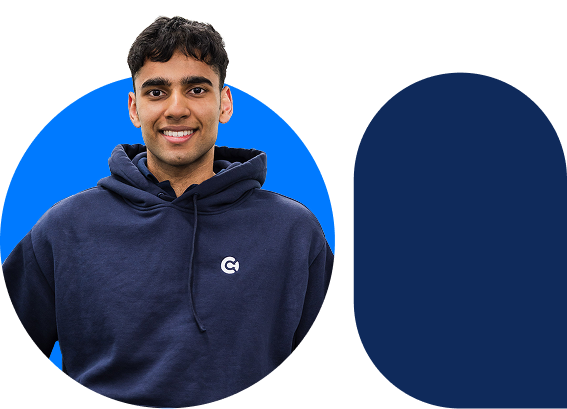 Smiling young man wearing a navy blue hoodie with a logo, against a blue circular background.