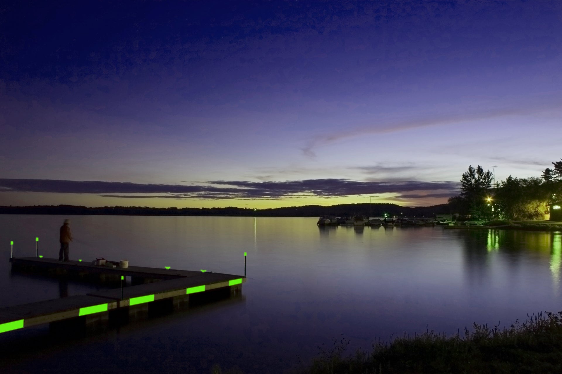 lake pier at dusk with glorope lining pier