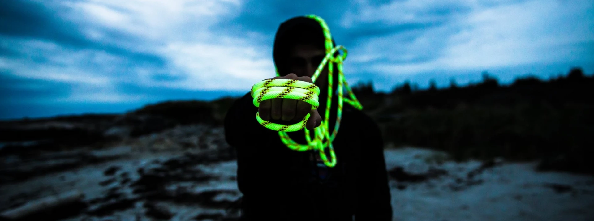 marine worker holding glorope at dusk