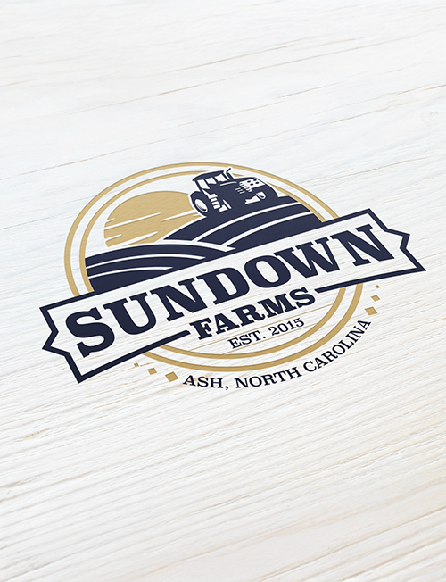 Logo for Sundown Farms featuring a tractor over stylized fields with the text 'Sundown Farms Est. 2015 Ash, North Carolina' on a light wooden background.