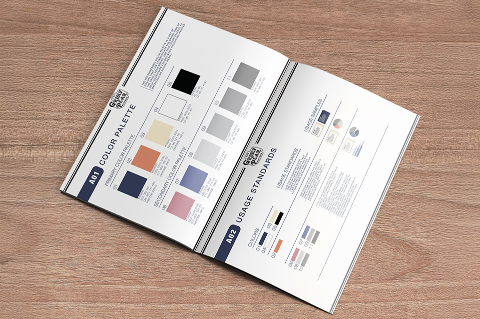 Open booklet on wood surface displaying a color palette and usage standards with color swatches and guidelines.