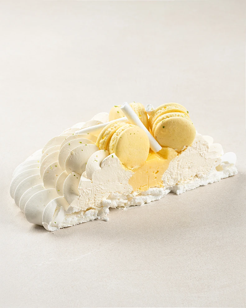 Lemon Pavlova cake slice showing layers