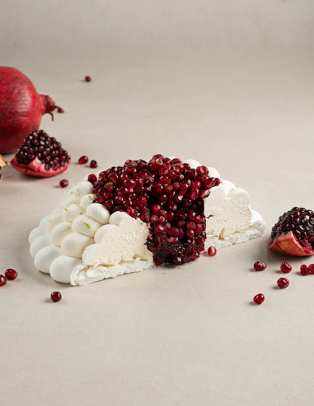 Pomegranate Pavlova cake slice showing layers