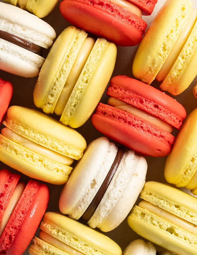 Close up of vanilla chocolate and fruit macarons