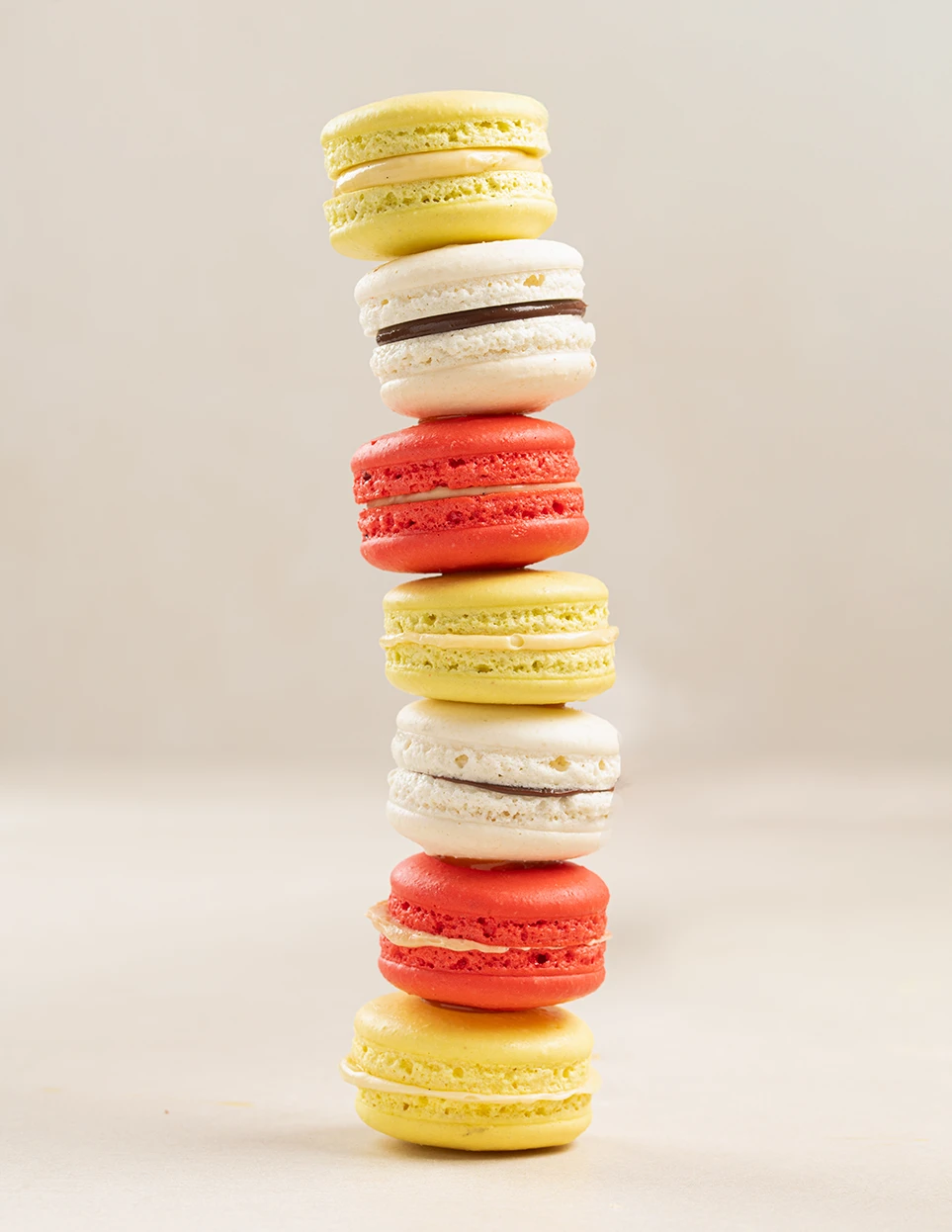 Stacked vanilla chocolate and fruit macarons