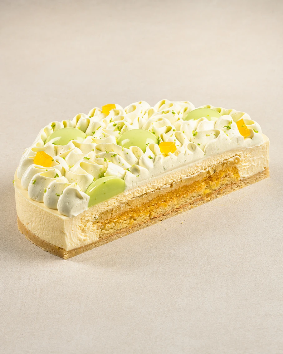 Zesty Mango cake slice showing layers