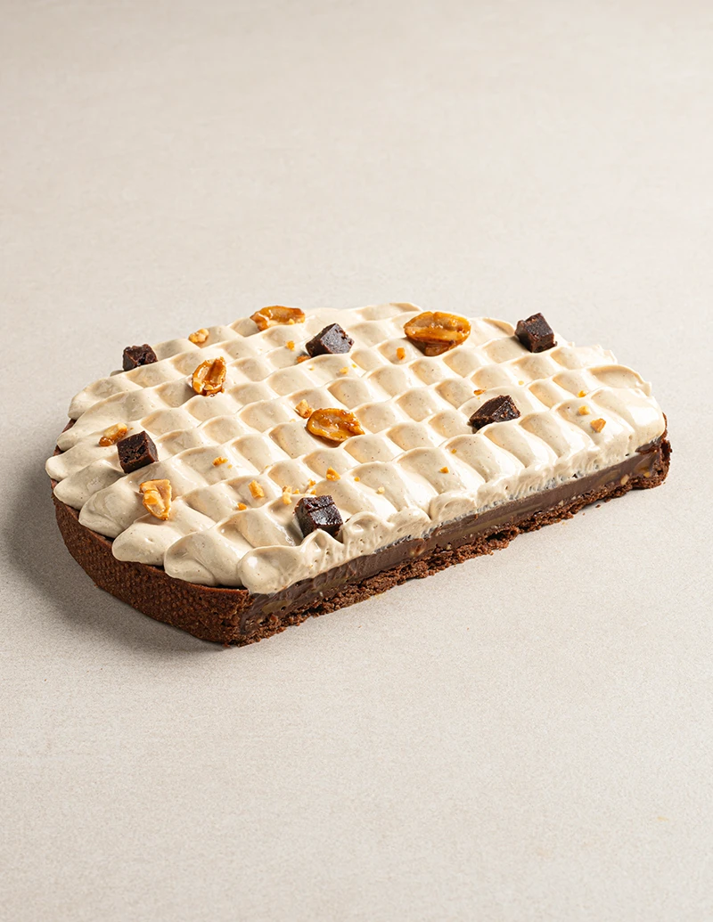 Snickers Tart cake slice showing layers