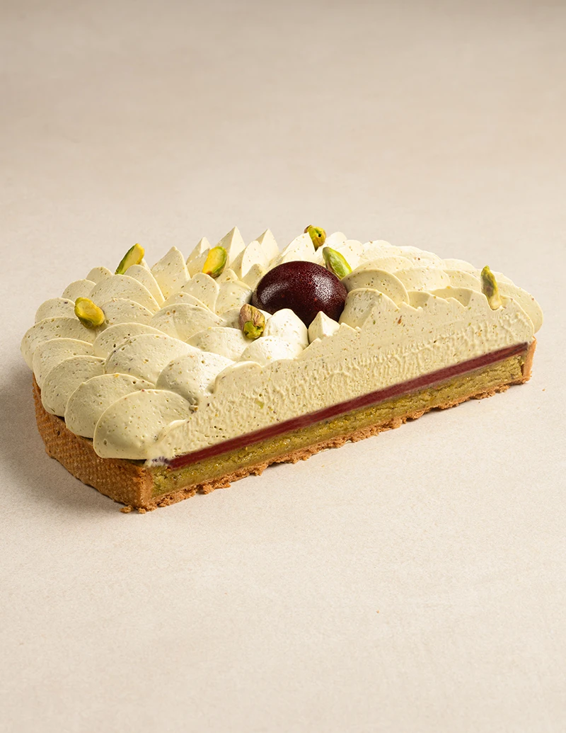 Pistachio Strawberry Tart cake slice showing layers