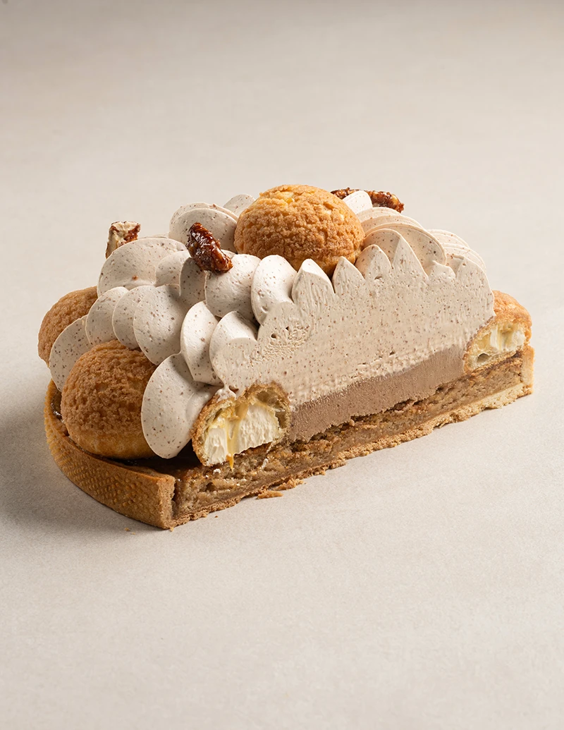 Pecan St. Honoré cake slice showing layers