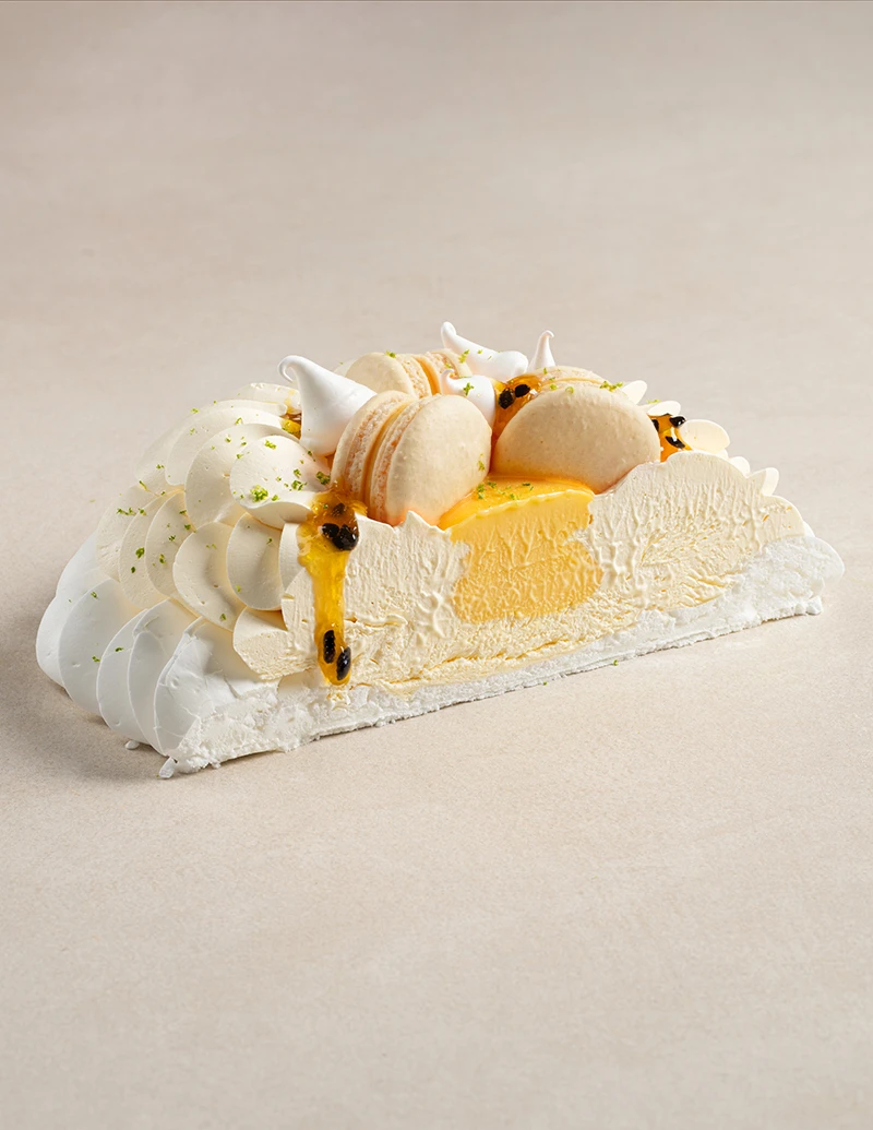 Passion Fruit Pavlova cake slice showing layers