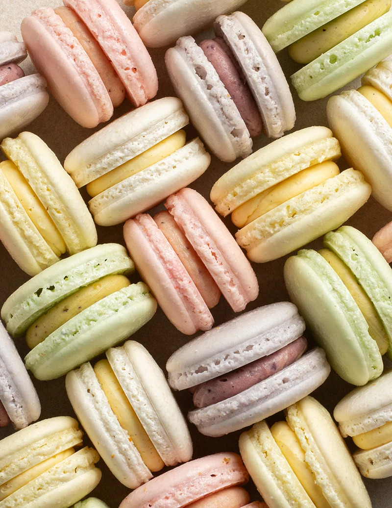 Assorted pastel macarons arranged in an elegant gift box from VANIL.