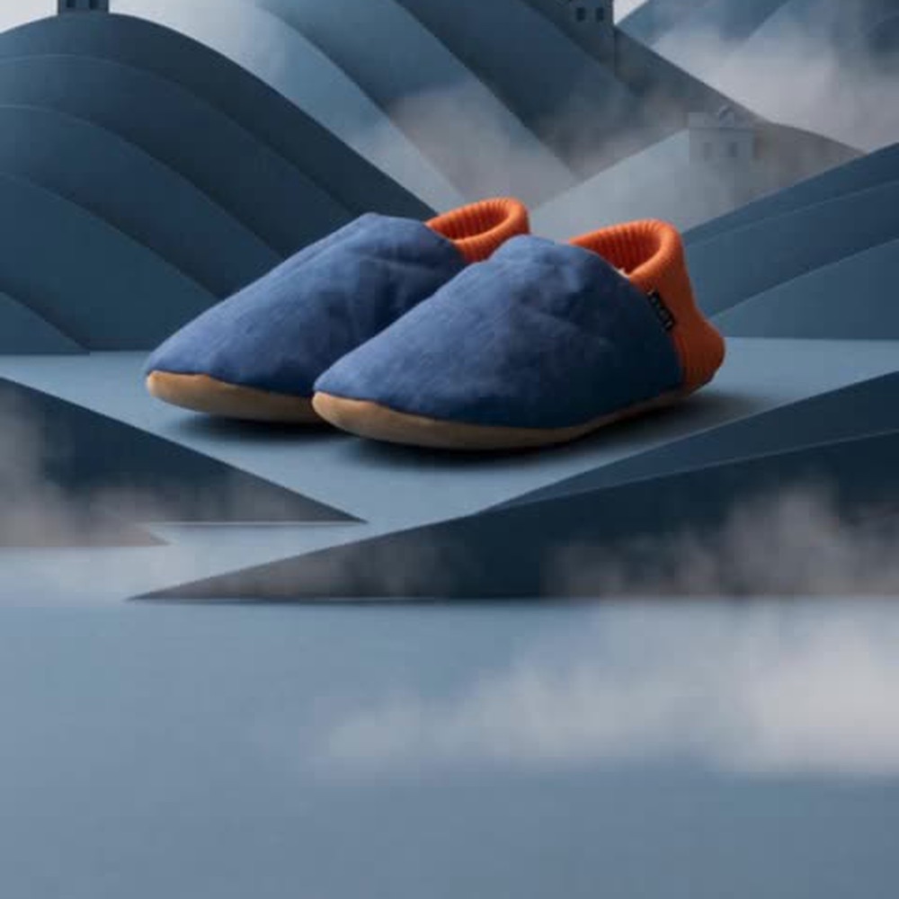 Approved TopDrawer concept creative of the slippers on a paper hill set made for a San Francisco location.