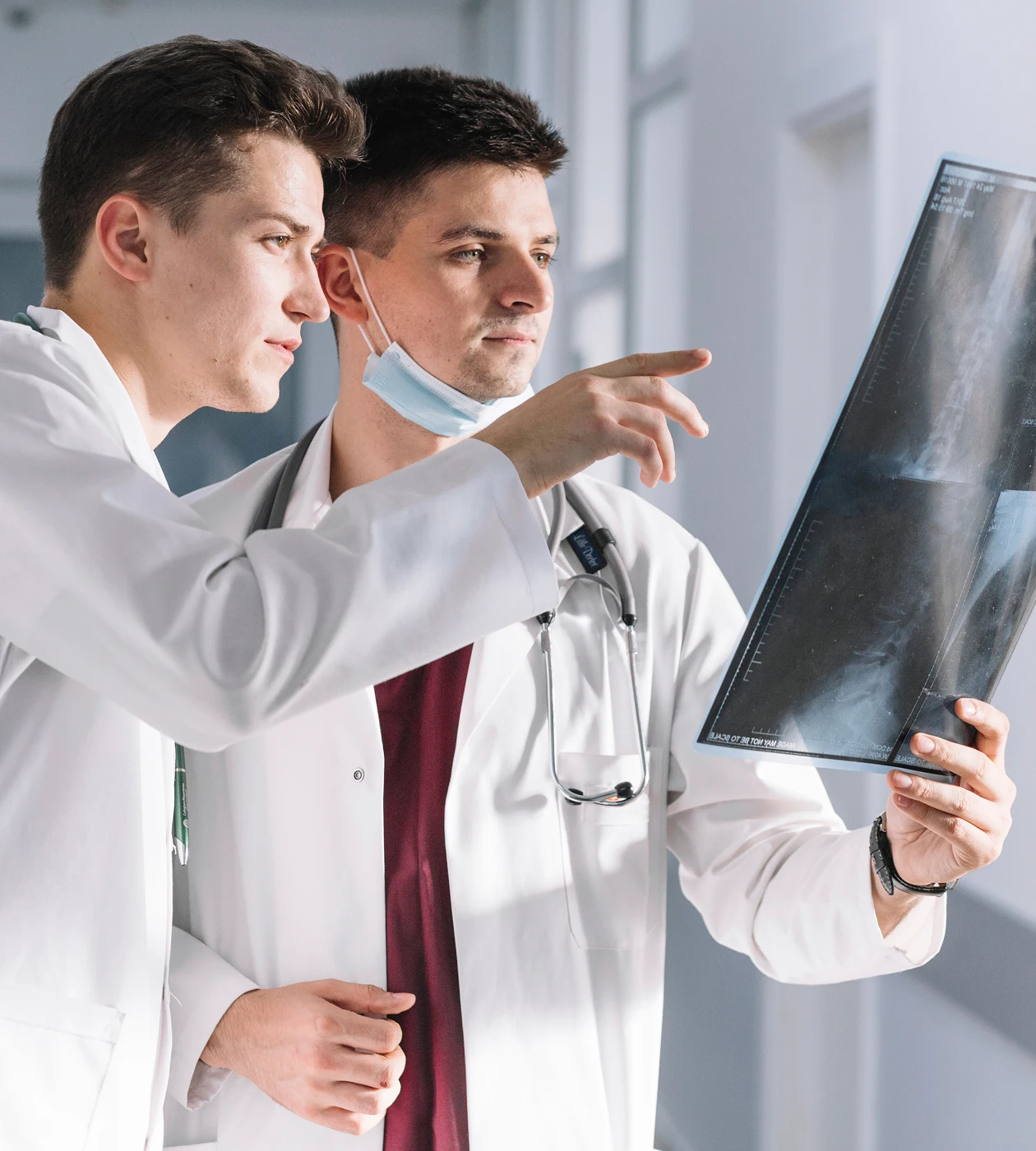 doctors-looking-x-ray-hallway