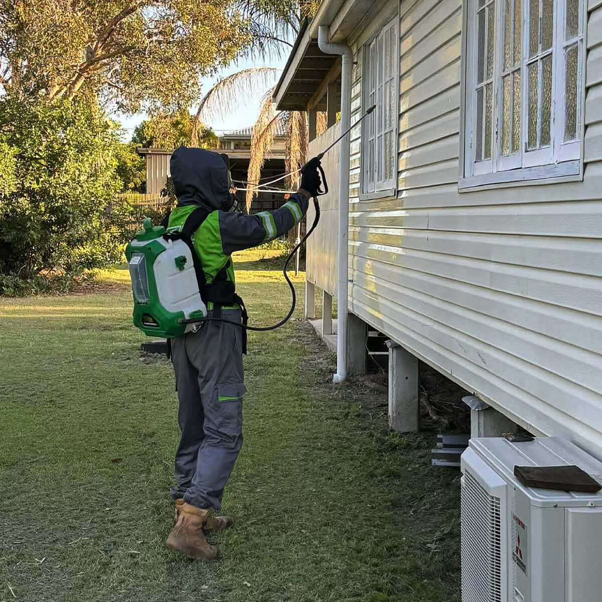 Pest management being completed on a Bundaberg house exterior