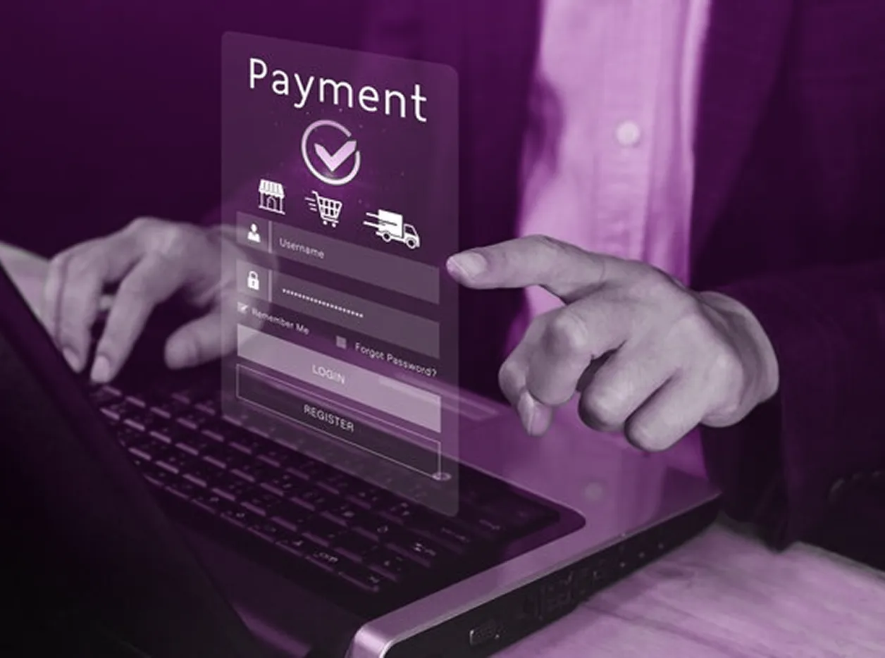 Person interacting with a holographic payment login interface above a laptop keyboard.