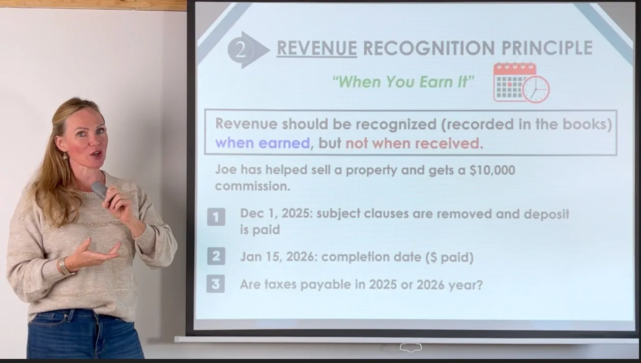 Woman holding a microphone beside a presentation slide about the Revenue Recognition Principle explaining when revenue should be recognized and listing key dates for a property sale commission.