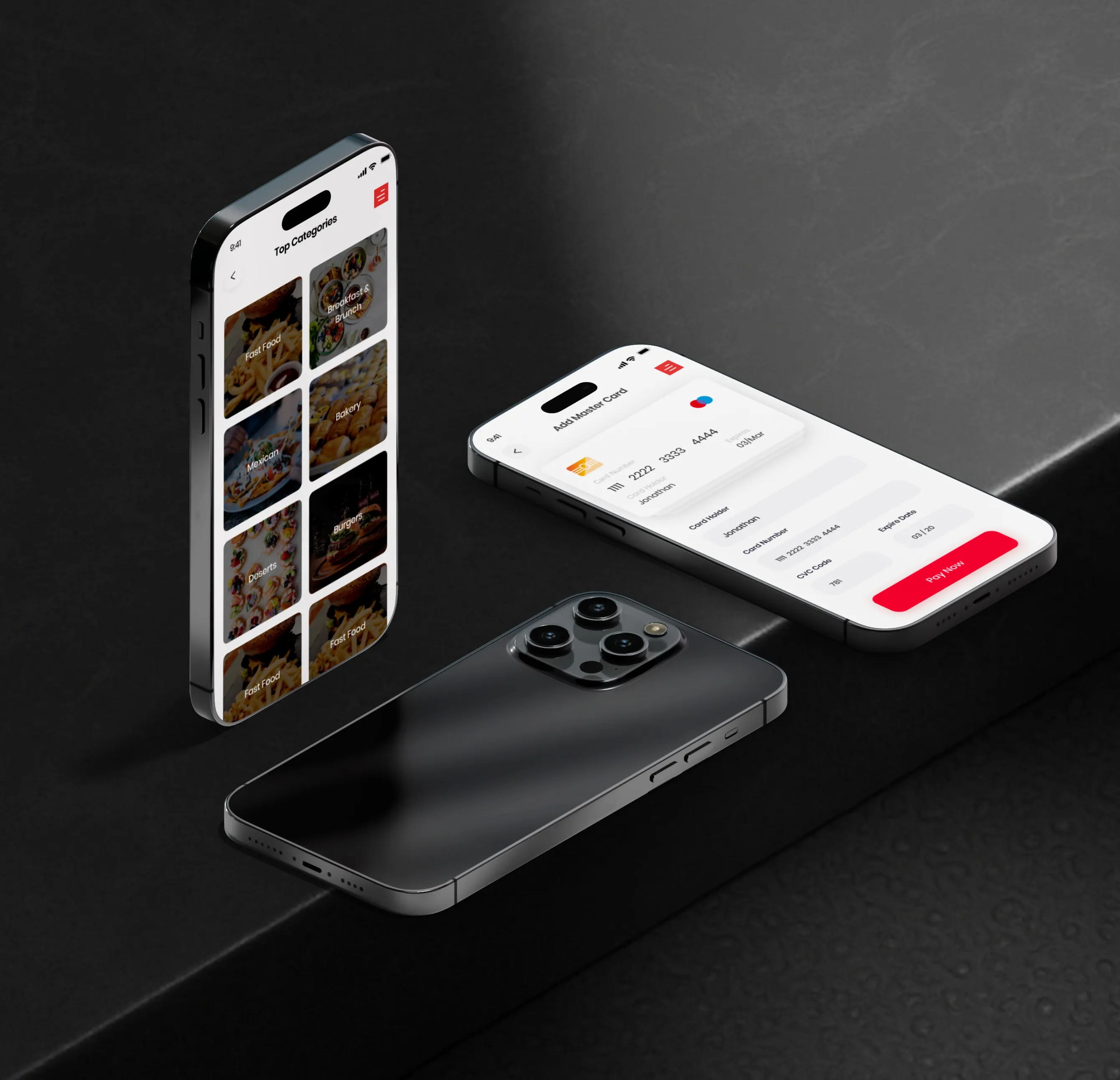 Three black smartphones on a dark surface showing food category and payment card app screens.