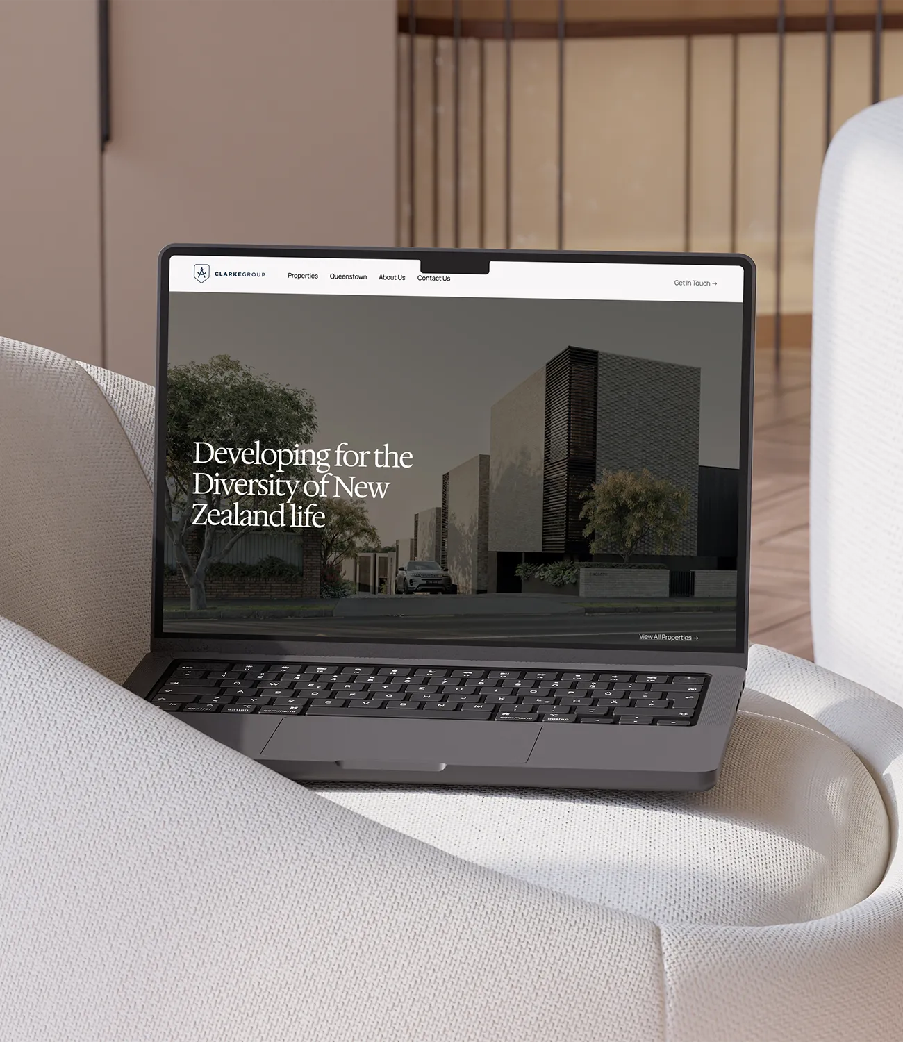 Open laptop on beige cushioned chair showing GEDMasters dashboard with progress in quizzes, average quiz score, videos completed, and current subscription details.