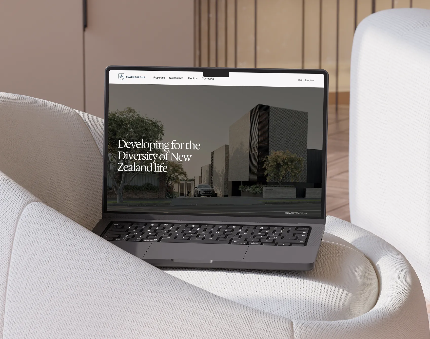 Silver laptop displaying an educational dashboard with user progress and subscription details on a beige cushioned chair.