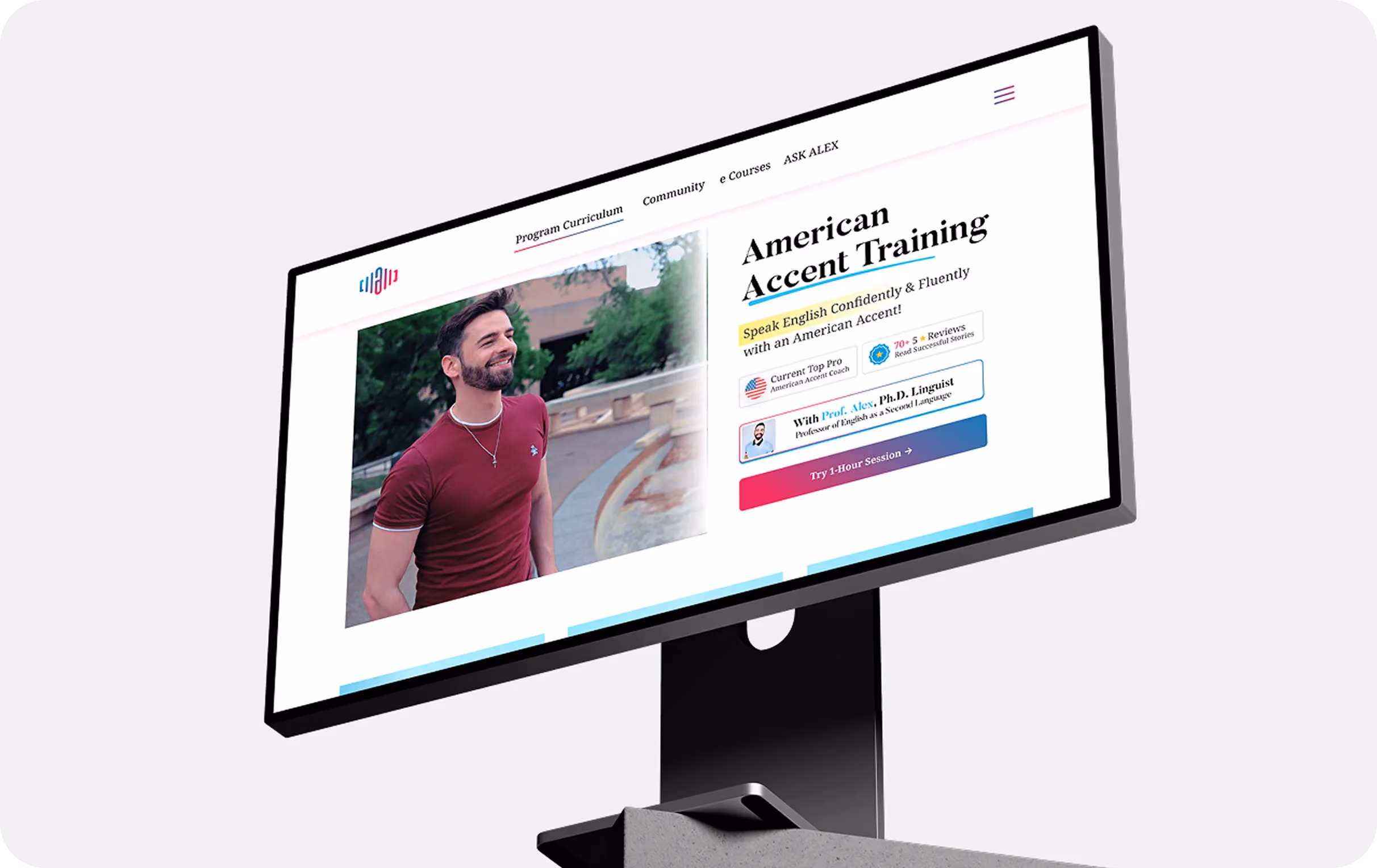 Computer screen shows American Accent Training program with a smiling man in a red shirt outdoors.