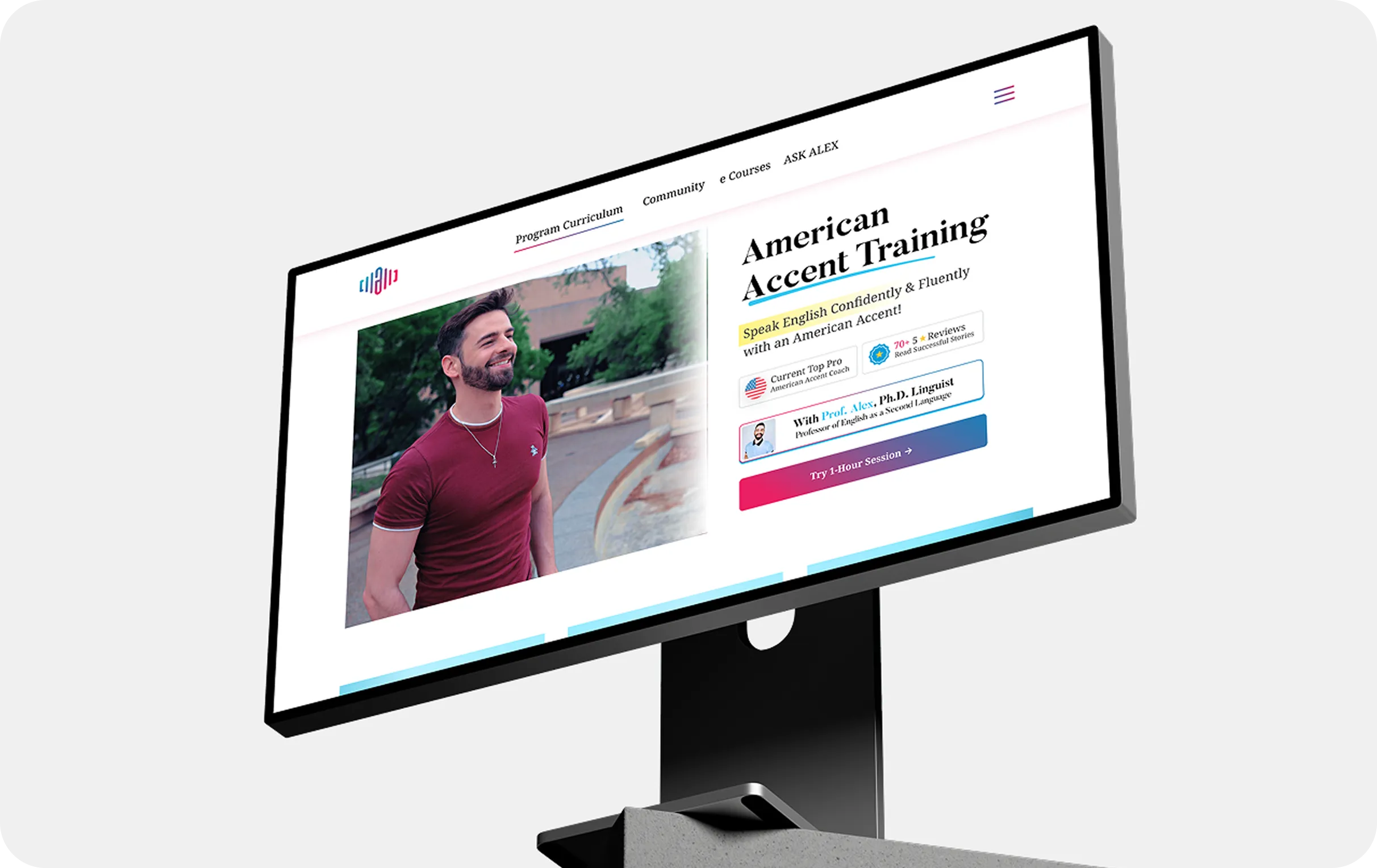 Computer screen shows American Accent Training program with a smiling man in a red shirt outdoors.