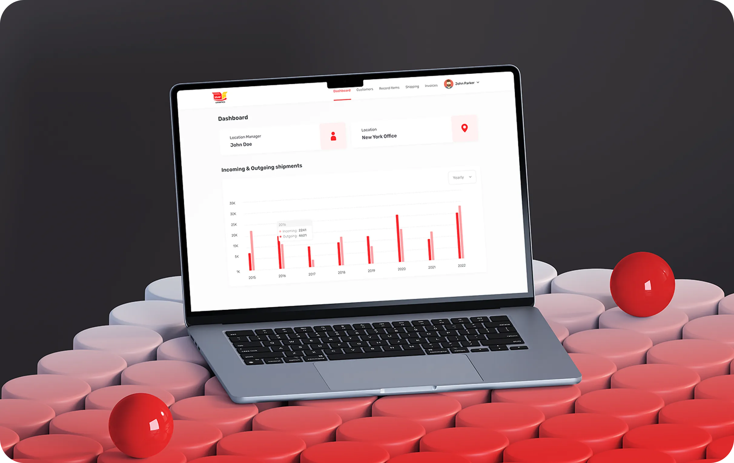 Laptop displaying a shipment dashboard with bar graphs on red and white circular platforms.