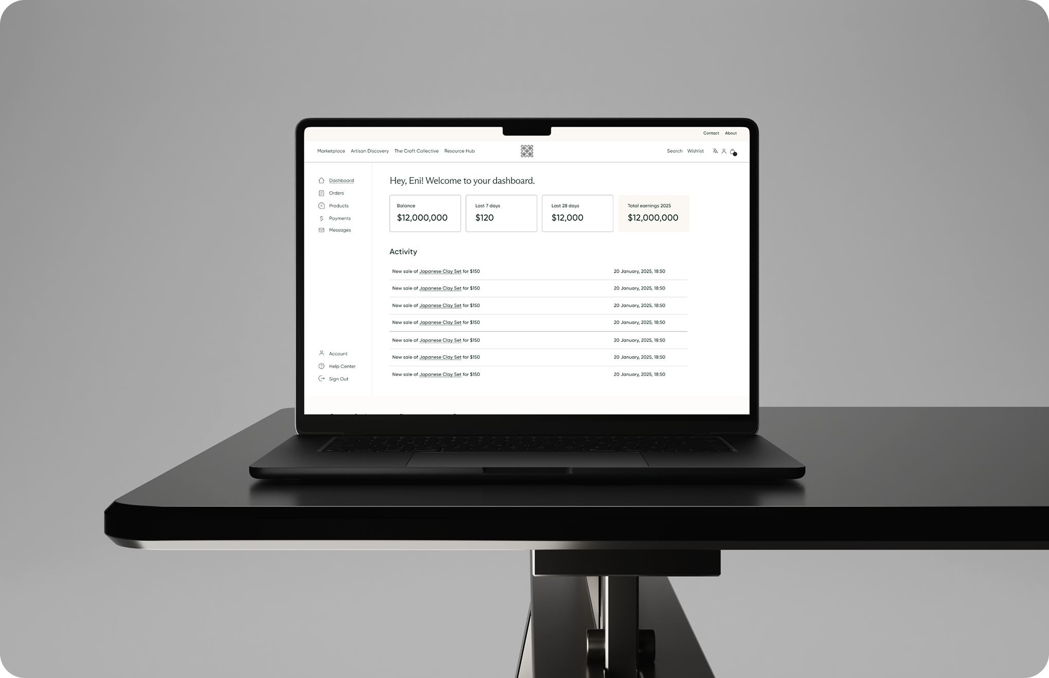 Black laptop on a black table showing a dashboard with sales, balance, and activity details.