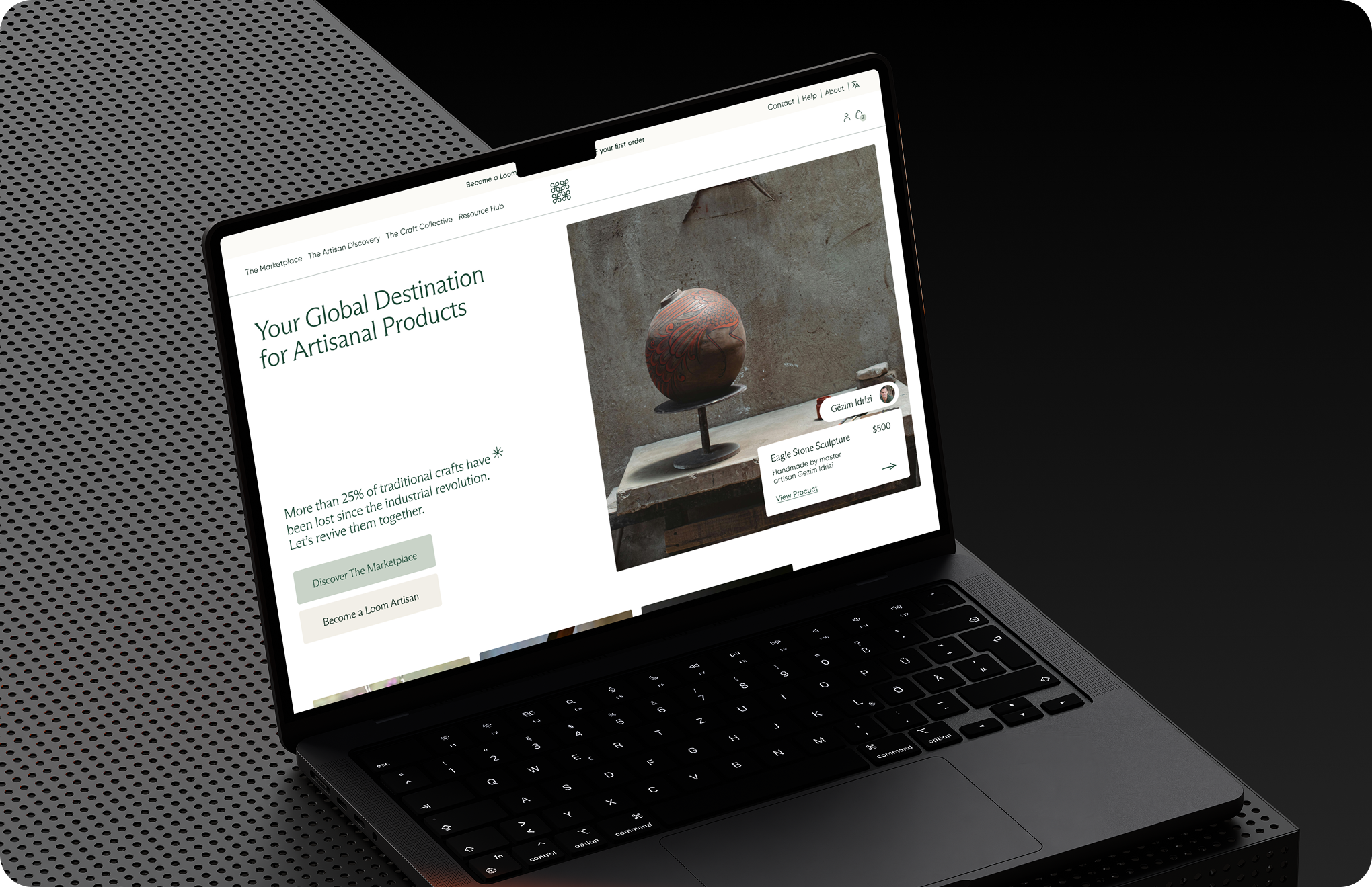 Laptop screen shows website for artisanal products featuring an eagle stone sculpture priced at $500.