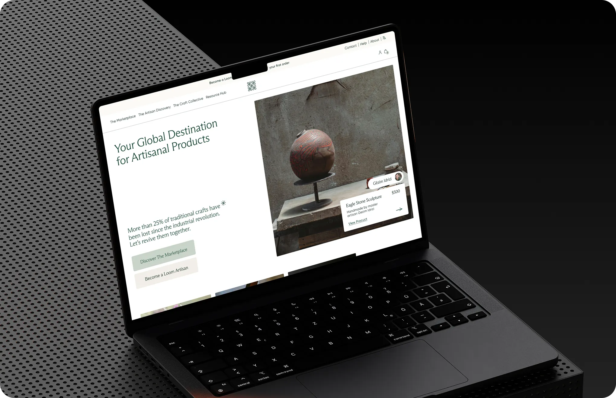 Laptop screen shows website for artisanal products featuring an eagle stone sculpture priced at $500.