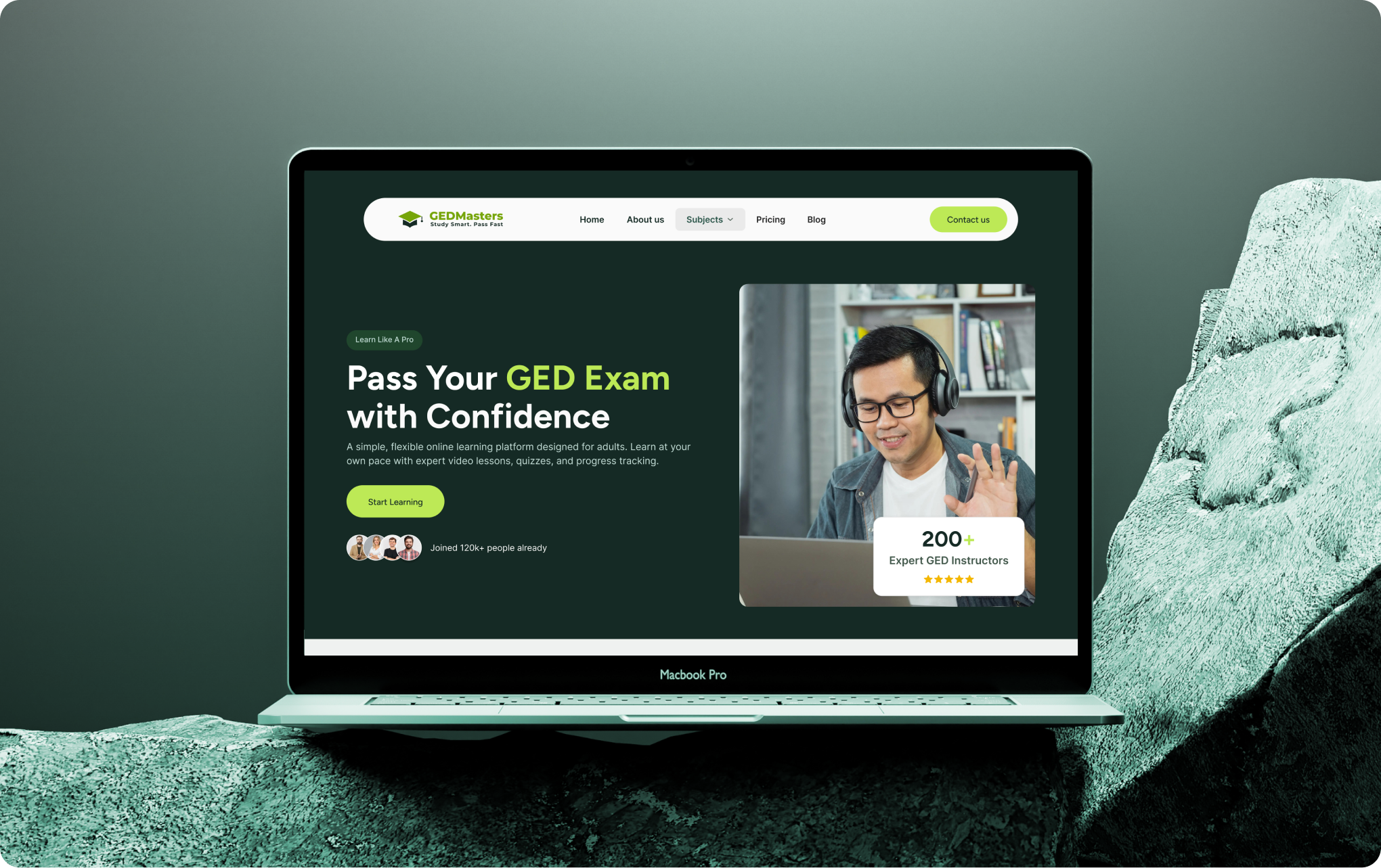 Laptop screen shows GEDMasters site offering online GED exam prep with expert instructors and flexible learning.