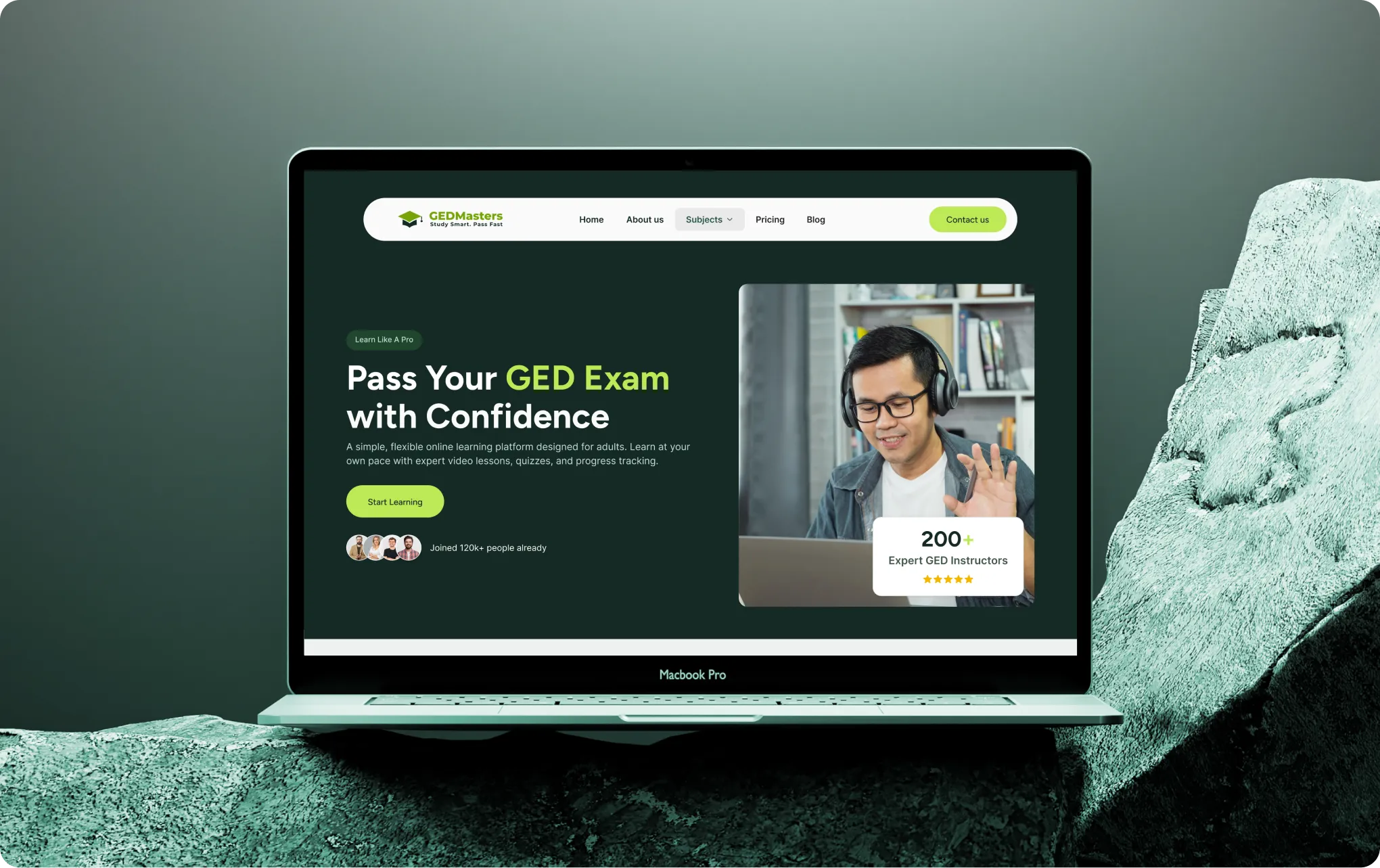 Laptop screen shows GEDMasters site offering online GED exam prep with expert instructors and flexible learning.