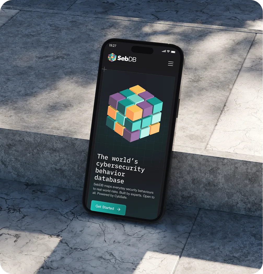 Smartphone screen showing SebDB cybersecurity behavior database with colorful cube and Get Started button.