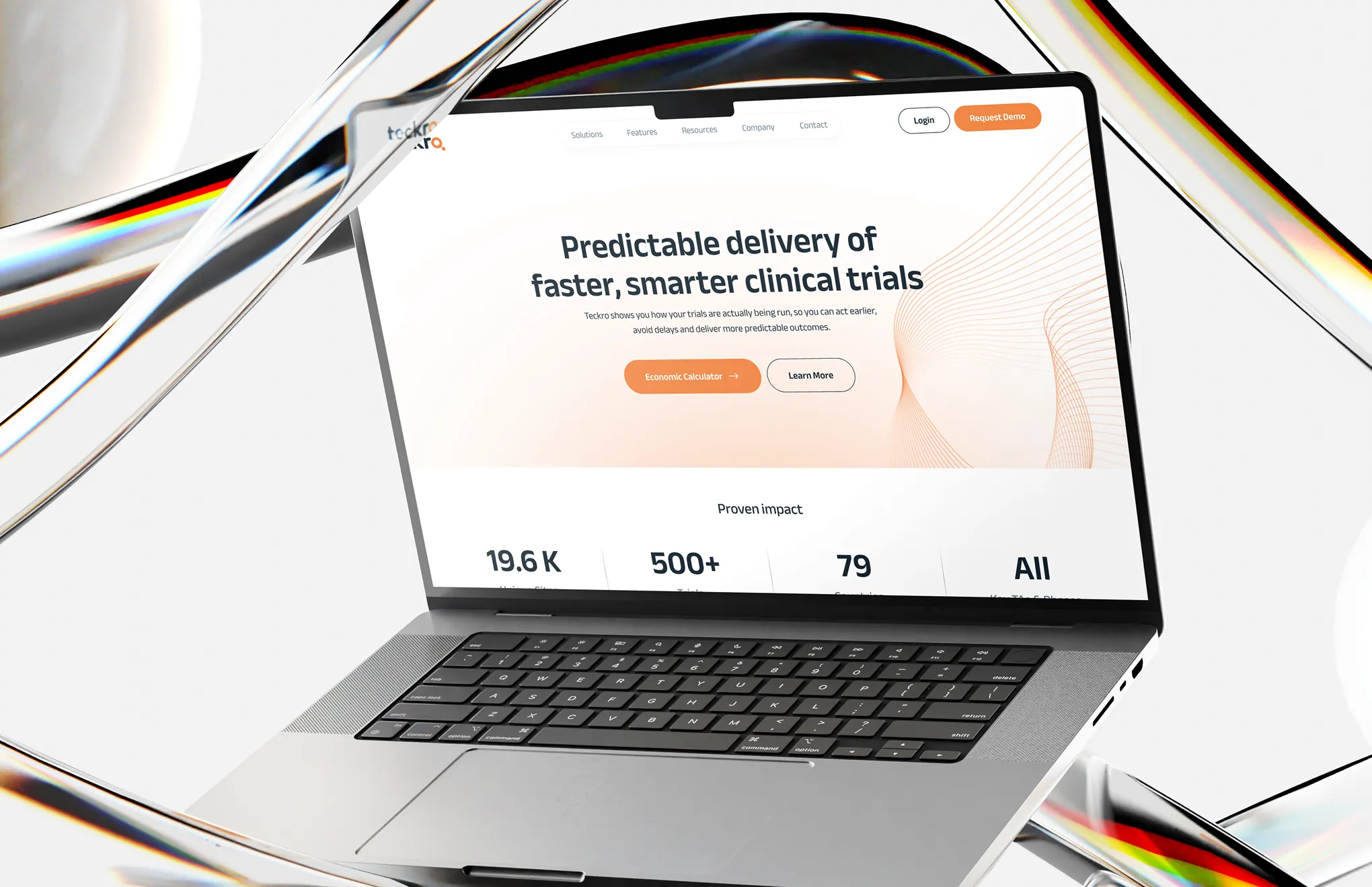 Open laptop showing a webpage about faster, smarter clinical trial delivery with call-to-action buttons.