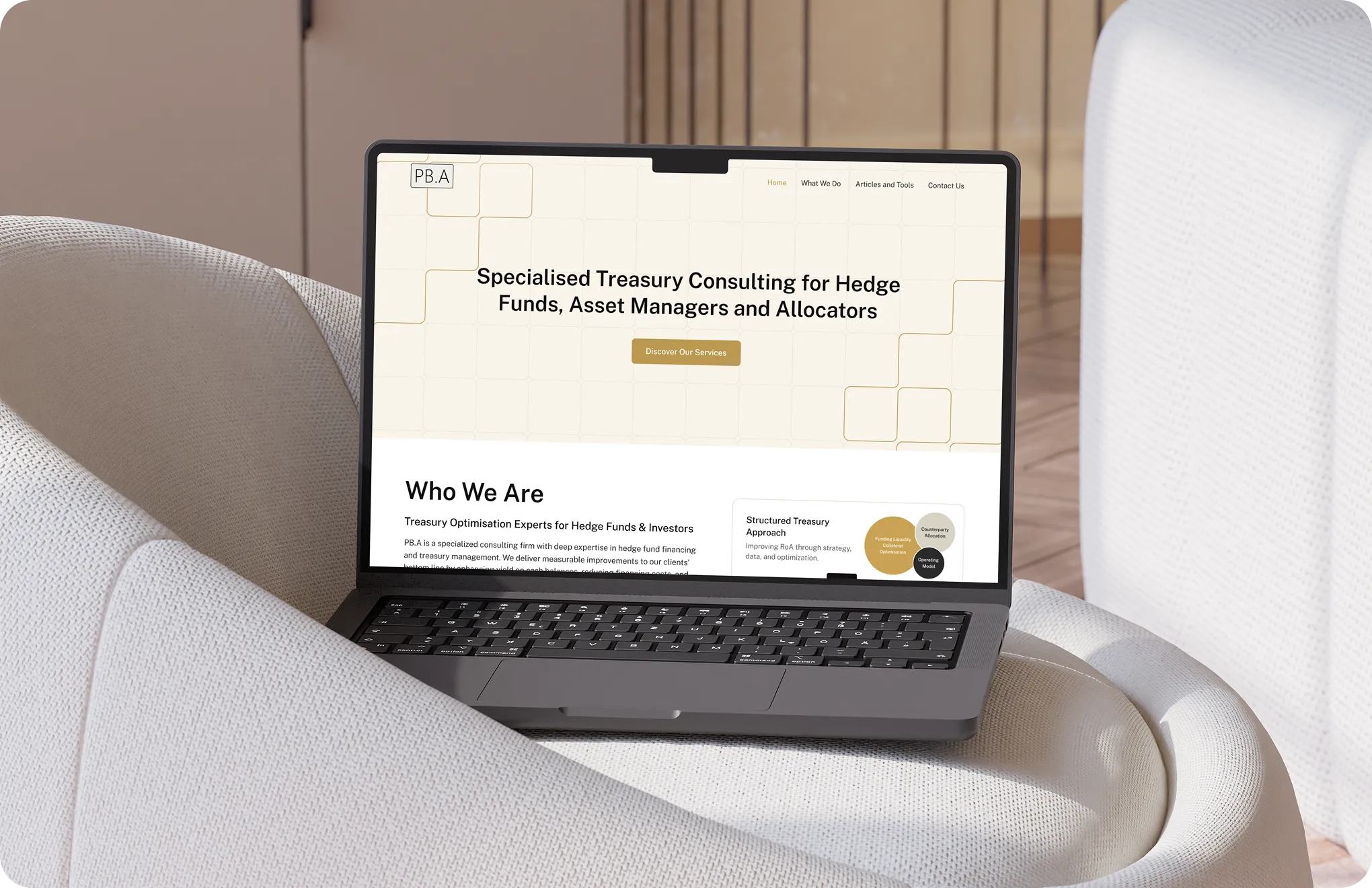 Laptop on white chair showing a consulting website for hedge funds and asset managers.